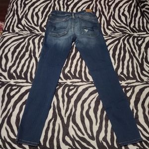 Medium wash destressed AE jeans